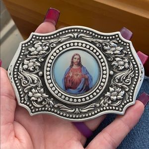 Jesus belt buckle.